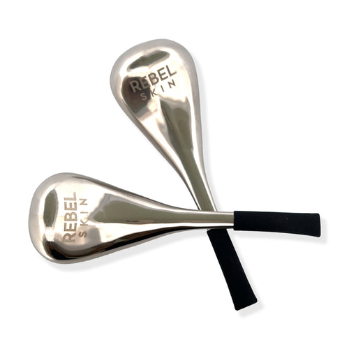 Stainless steel REBEL ICE globes for therapeutic skincare treatment.